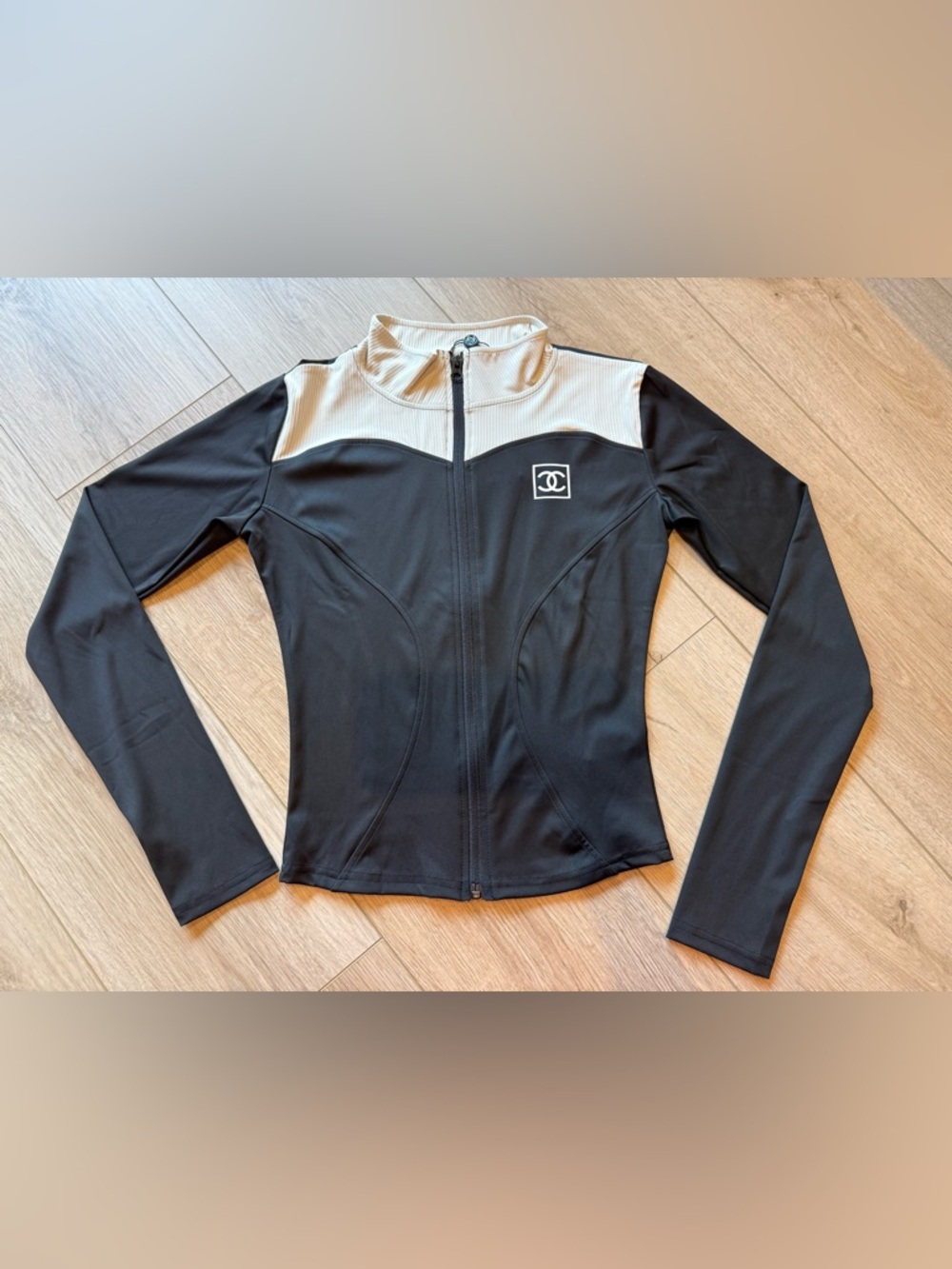 Black and cream zip up top